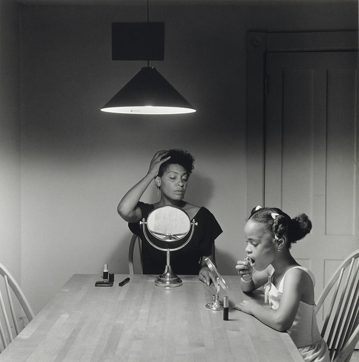 CARRIE MAE WEEMS (1953 -   ) Untitled (Woman and daughter with makeup).